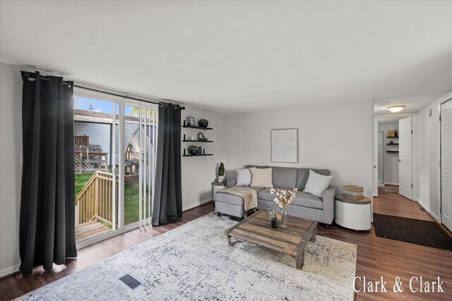 1873 Veronica St SE, Lowell, MI 49331 - living area featuring wood finished floors and baseboards
