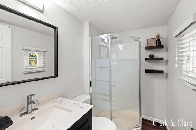 1873 Veronica St SE, Lowell, MI 49331 - bathroom with vanity, a shower stall, and a textured ceiling