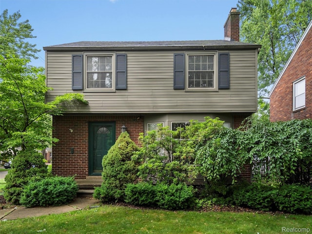1930 Kenmore Dr, Grosse Pointe Woods, MI 48236 - view of front of home featuring a chimney and brick siding