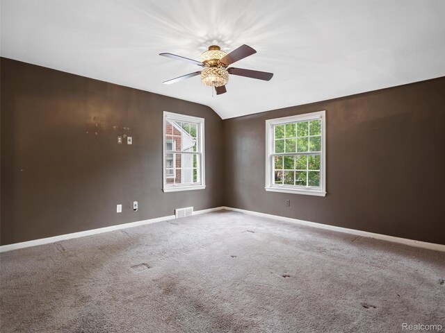 1930 Kenmore Dr, Grosse Pointe Woods, MI 48236 - carpeted spare room featuring ceiling fan and vaulted ceiling