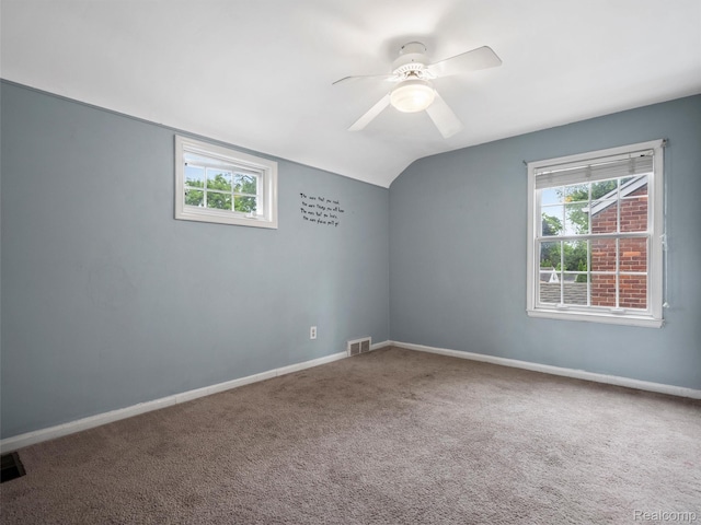 1930 Kenmore Dr, Grosse Pointe Woods, MI 48236 - carpeted spare room with plenty of natural light, vaulted ceiling, and a ceiling fan