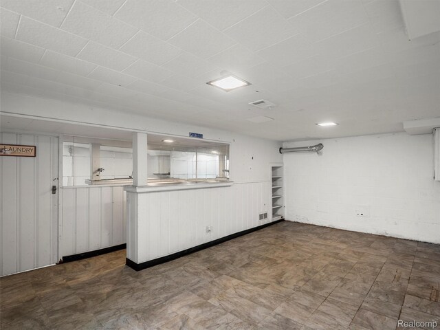 1930 Kenmore Dr, Grosse Pointe Woods, MI 48236 - basement featuring dark flooring and wooden walls