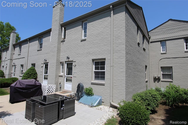 1670 Graefield Rd, Birmingham, MI 48009 - back of house featuring a patio area and a chimney