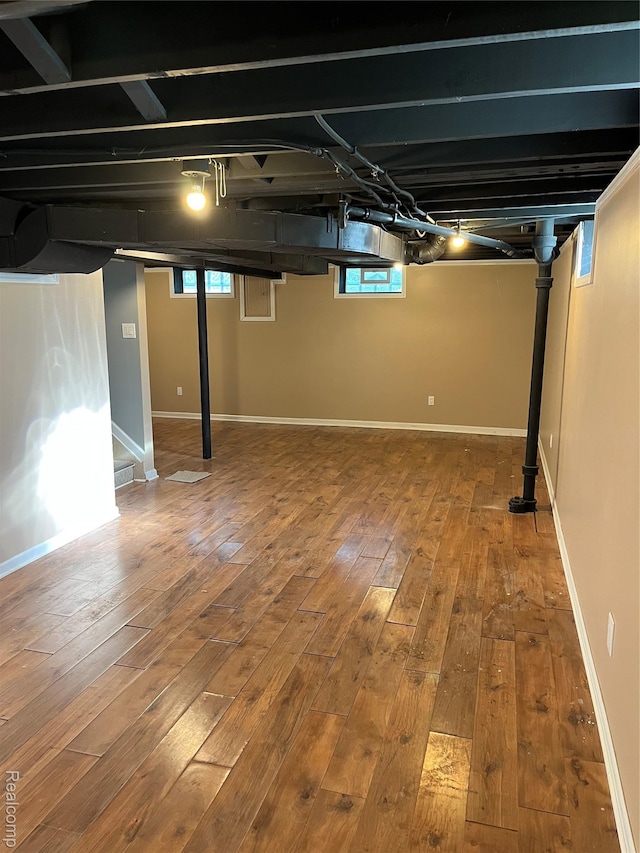 44 Pleasantview Dr, Pontiac, MI 48341 - basement featuring hardwood / wood-style flooring and stairway