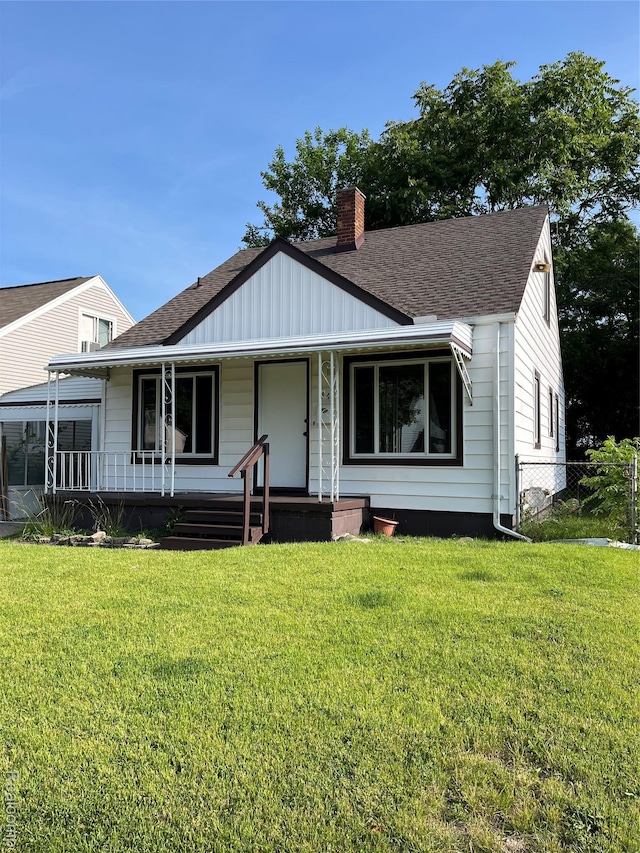 44 Pleasantview Dr, Pontiac, MI 48341 - view of front facade featuring covered porch, a chimney, board and batten siding, and a shingled roof