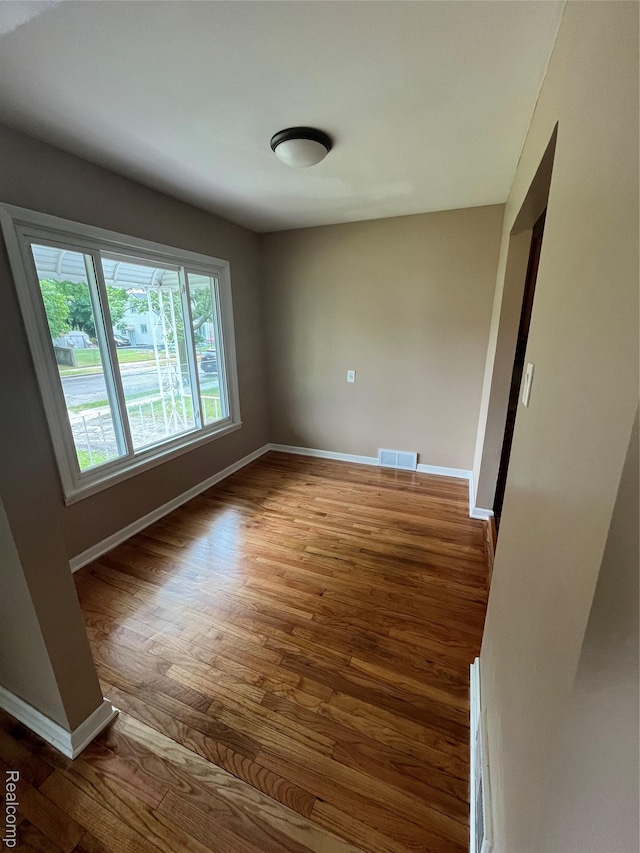 44 Pleasantview Dr, Pontiac, MI 48341 - empty room with dark wood-type flooring and baseboards