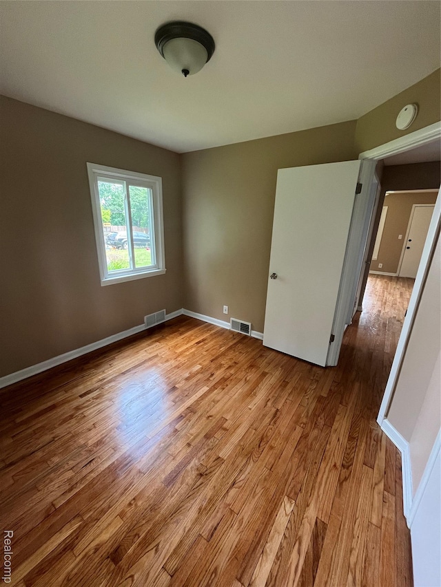 44 Pleasantview Dr, Pontiac, MI 48341 - empty room featuring wood finished floors and baseboards