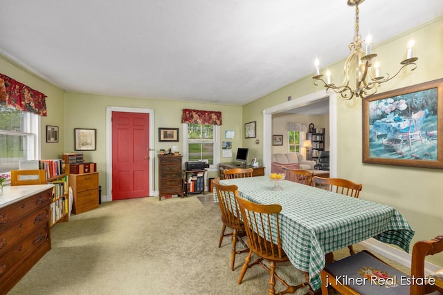 7115 Bronson St SE, Ada, MI 49301 - dining space featuring a chandelier and light carpet