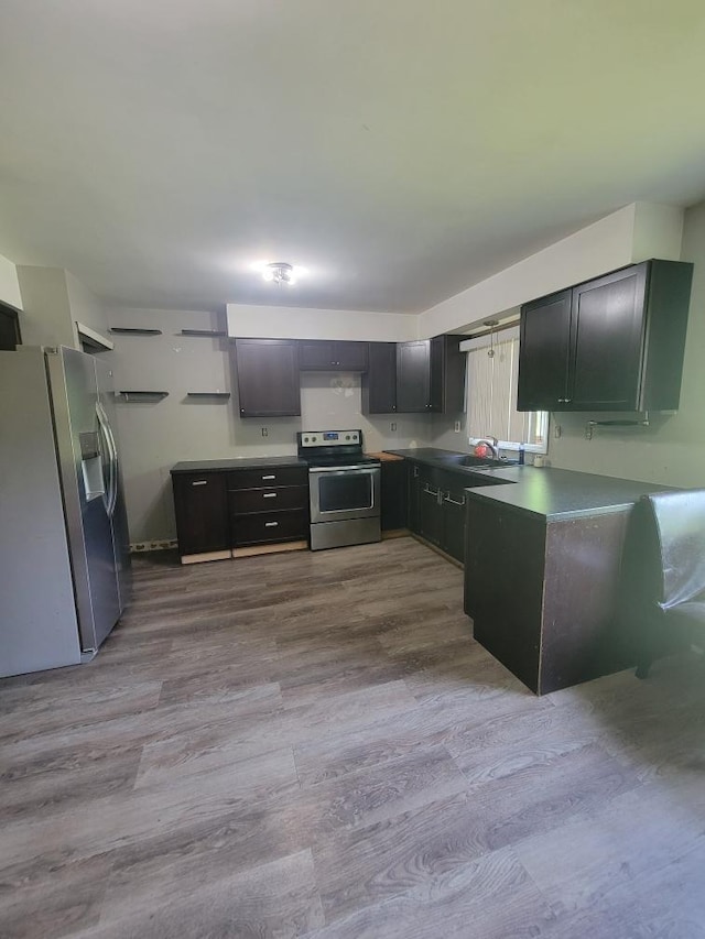 14300 Tuttlehill, Milan, MI 48160 - kitchen with appliances with stainless steel finishes, dark wood-style floors, open shelves, and dark countertops