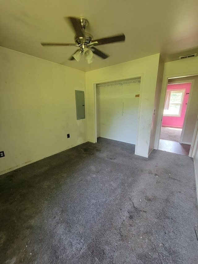 14300 Tuttlehill, Milan, MI 48160 - unfurnished bedroom featuring electric panel, a closet, a ceiling fan, and carpet flooring