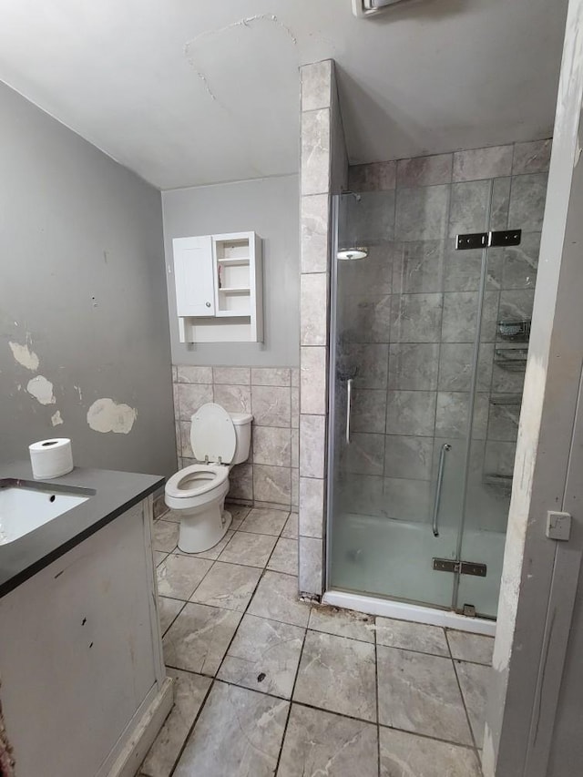 14300 Tuttlehill, Milan, MI 48160 - bathroom featuring vanity, a stall shower, marble finish flooring, and tile walls