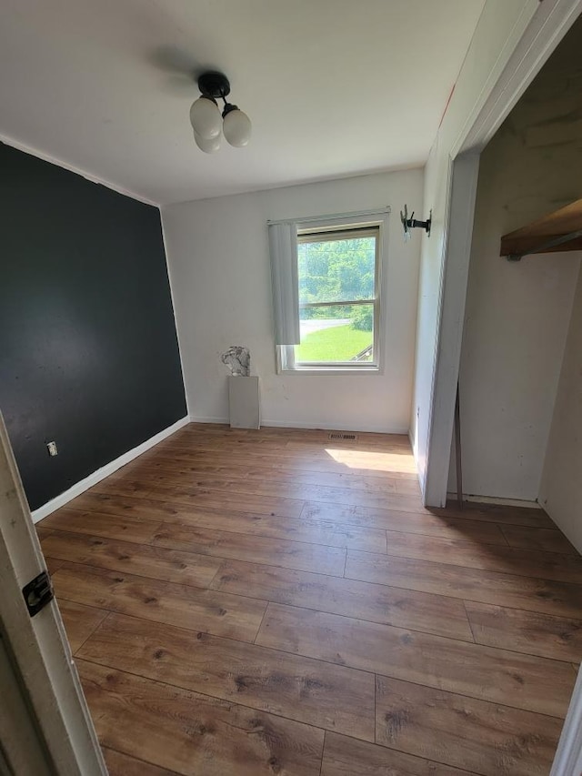 14300 Tuttlehill, Milan, MI 48160 - unfurnished bedroom with wood-type flooring