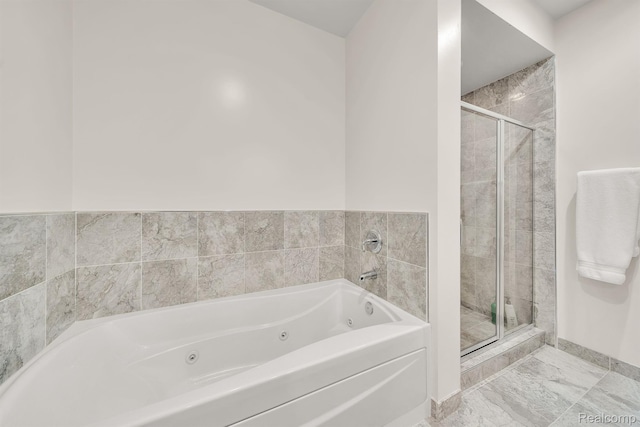 1135 Shelby St Unit 59-2808, Detroit, MI 48226 - bathroom featuring a jetted tub, a shower stall, and marble finish floors