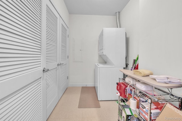 1135 Shelby St Unit 59-2808, Detroit, MI 48226 - washroom with stacked washer and clothes dryer, light flooring, and electric panel
