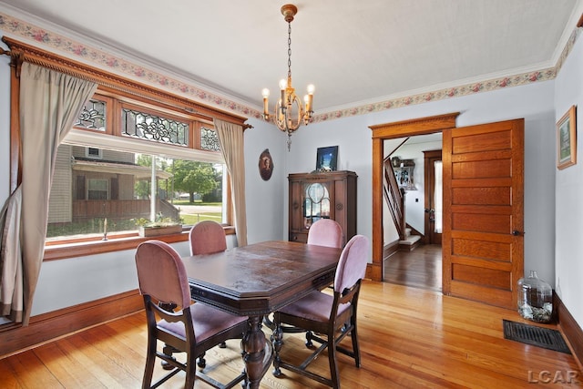 203 S Main St, Onsted, MI 49265 - dining room featuring a chandelier and light wood finished floors