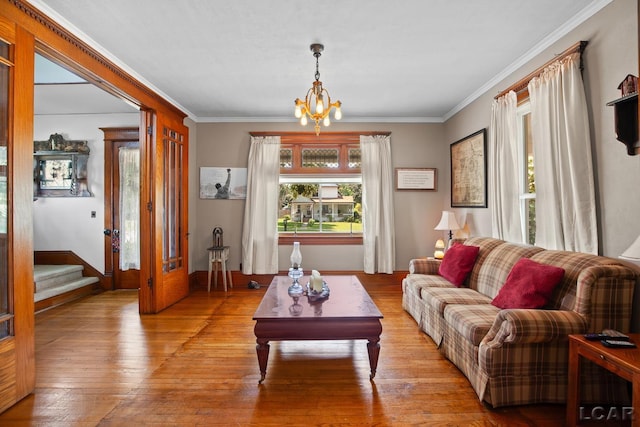 203 S Main St, Onsted, MI 49265 - living area with a chandelier, crown molding, stairway, and hardwood / wood-style flooring