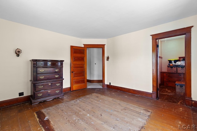 203 S Main St, Onsted, MI 49265 - unfurnished bedroom with hardwood / wood-style floors and baseboards