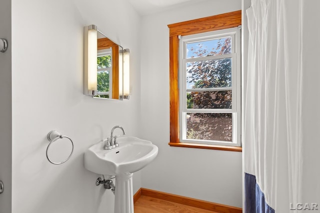 203 S Main St, Onsted, MI 49265 - bathroom featuring healthy amount of natural light and wood finished floors