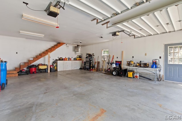 203 S Main St, Onsted, MI 49265 - garage featuring a garage door opener