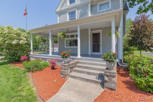 203 S Main St, Onsted, MI 49265 - view of front facade featuring covered porch