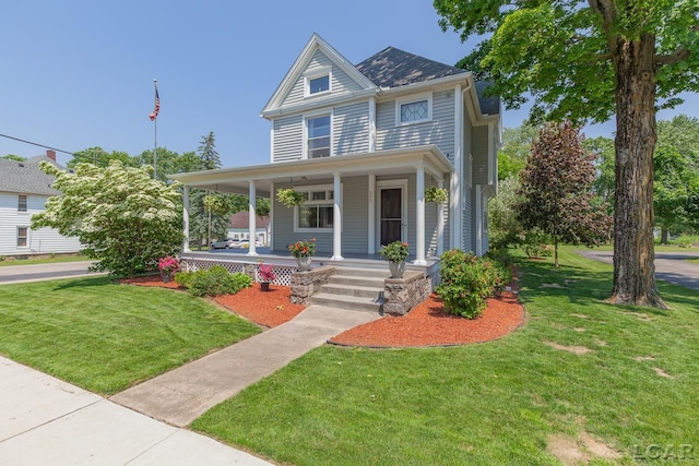 203 S Main St, Onsted, MI 49265 - view of front of home with a porch and a front yard