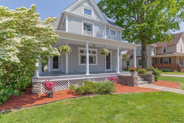 203 S Main St, Onsted, MI 49265 - farmhouse-style home featuring a porch and a front lawn