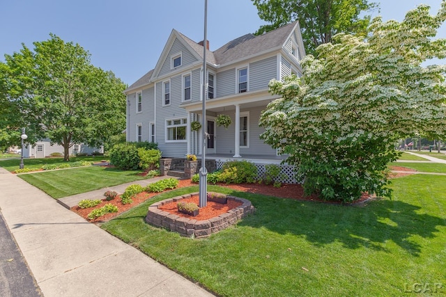 203 S Main St, Onsted, MI 49265 - view of front of property featuring a porch and a front yard
