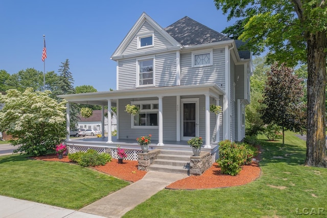 203 S Main St, Onsted, MI 49265 - view of front of property with covered porch and a front yard