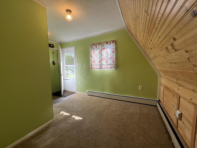 7428 Ansley Ln, Hillsdale, MI 49242 - carpeted spare room featuring lofted ceiling, a baseboard heating unit, a baseboard radiator, and wooden walls