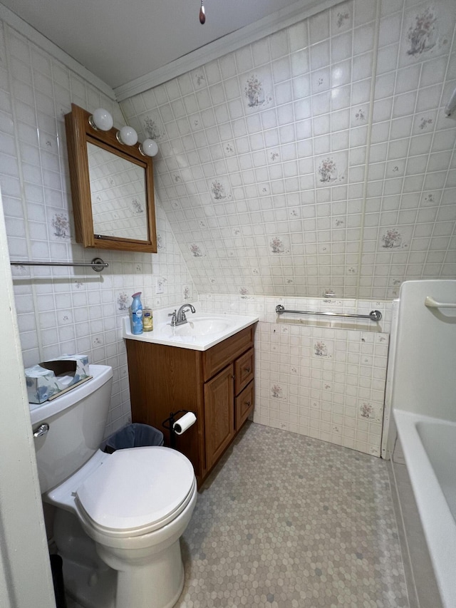 7428 Ansley Ln, Hillsdale, MI 49242 - full bathroom with tile walls, vanity, a tub to relax in, and ornamental molding