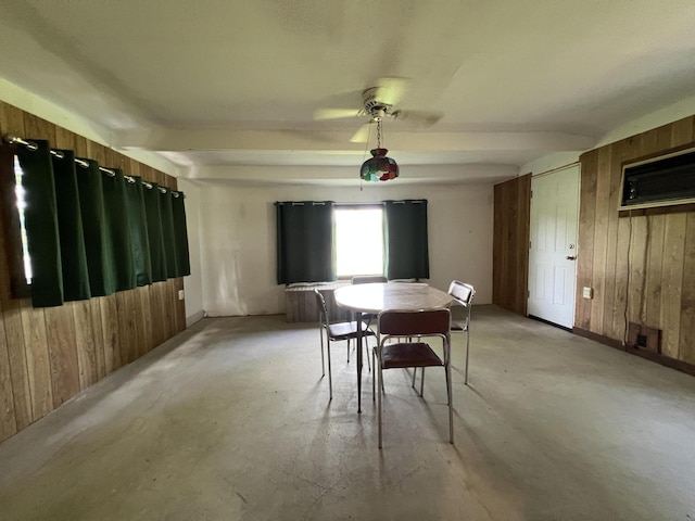 7428 Ansley Ln, Hillsdale, MI 49242 - dining area with wood walls, an AC wall unit, and concrete flooring
