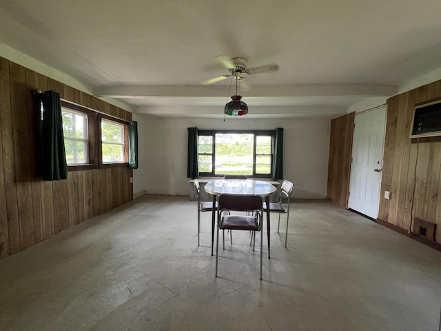 7428 Ansley Ln, Hillsdale, MI 49242 - dining room featuring wooden walls, concrete floors, ceiling fan, and a wall mounted air conditioner