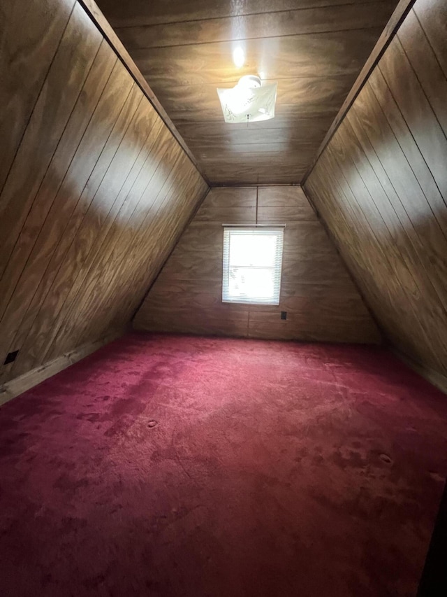 7428 Ansley Ln, Hillsdale, MI 49242 - bonus room featuring carpet floors, lofted ceiling, and wooden walls