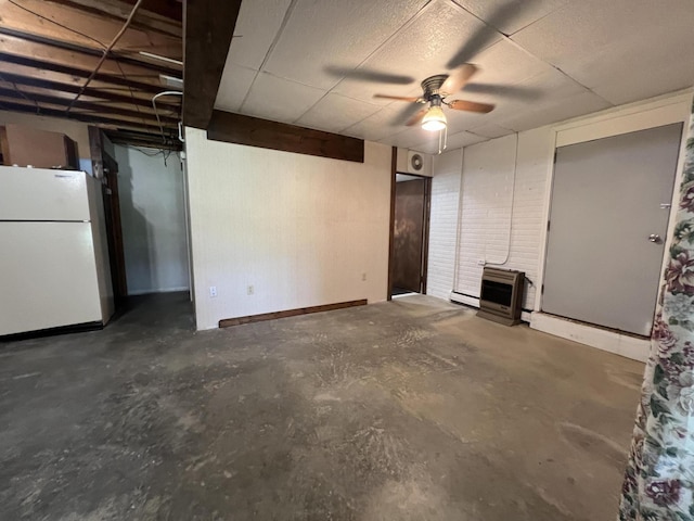 7428 Ansley Ln, Hillsdale, MI 49242 - basement featuring freestanding refrigerator, ceiling fan, a baseboard heating unit, and heating unit