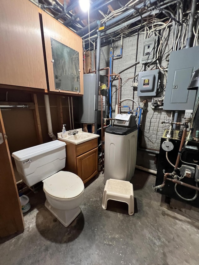 7428 Ansley Ln, Hillsdale, MI 49242 - bathroom with concrete floors, electric panel, water heater, vanity, and washer / dryer