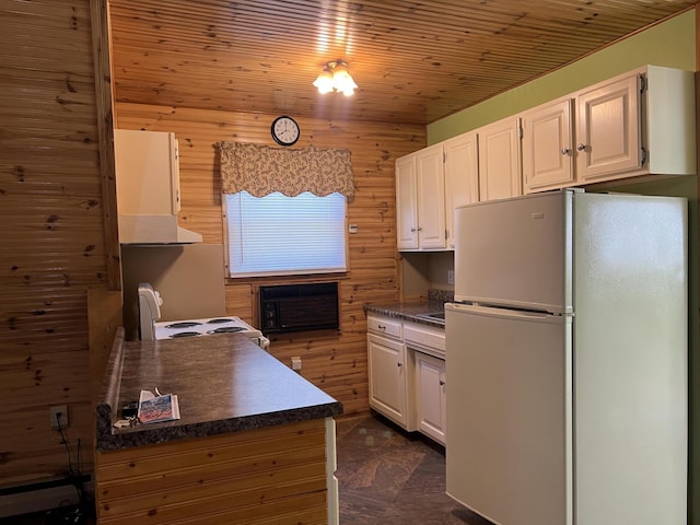 7428 Ansley Ln, Hillsdale, MI 49242 - kitchen featuring white appliances, dark countertops, white cabinetry, wood walls, and wood ceiling