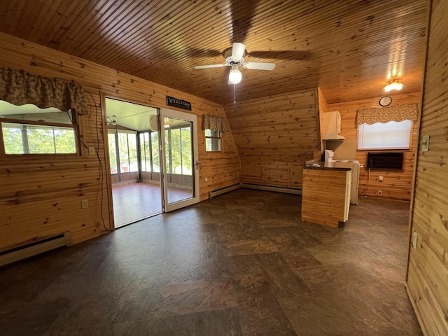 7428 Ansley Ln, Hillsdale, MI 49242 - unfurnished living room featuring wooden walls, a ceiling fan, a baseboard radiator, a baseboard heating unit, and wooden ceiling