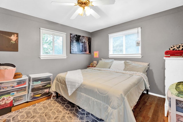 29206 Guy St, Southfield, MI 48076 - bedroom with wood finished floors, multiple windows, and ceiling fan