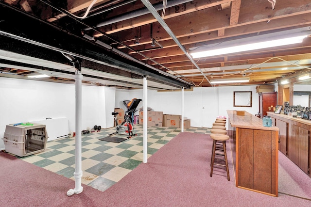 29206 Guy St, Southfield, MI 48076 - finished basement with tile patterned floors and a dry bar
