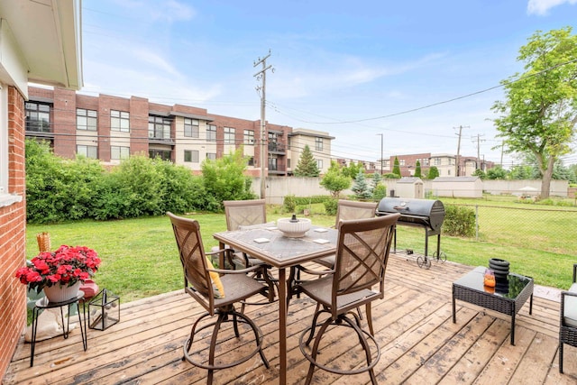 29206 Guy St, Southfield, MI 48076 - wooden terrace featuring area for grilling, outdoor dining space, and a fenced backyard