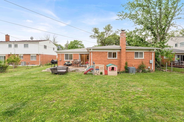 29206 Guy St, Southfield, MI 48076 - rear view of property with brick siding, a chimney, a fenced backyard, and a patio