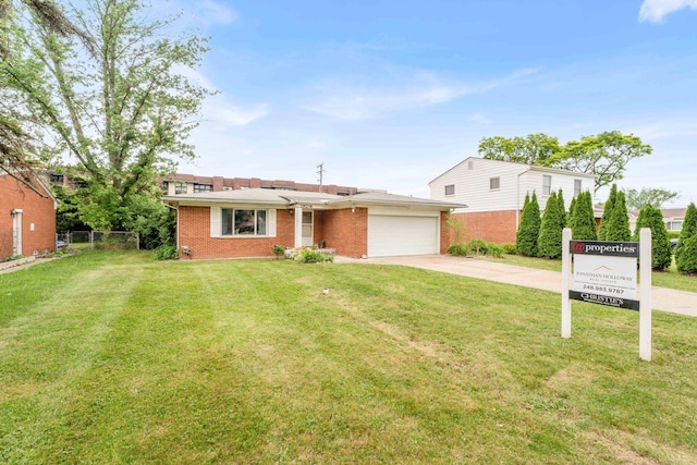 29206 Guy St, Southfield, MI 48076 - view of front facade featuring brick siding, concrete driveway, and a garage