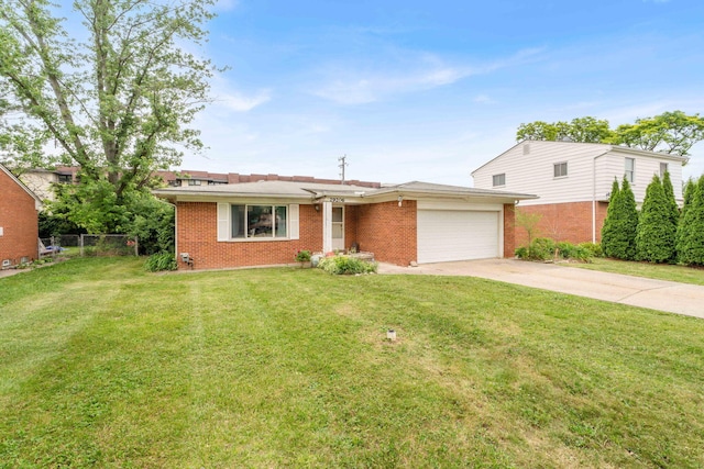 29206 Guy St, Southfield, MI 48076 - view of front of property with a garage, brick siding, and concrete driveway