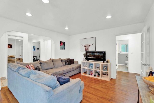 29206 Guy St, Southfield, MI 48076 - living room with arched walkways, light wood-type flooring, and recessed lighting