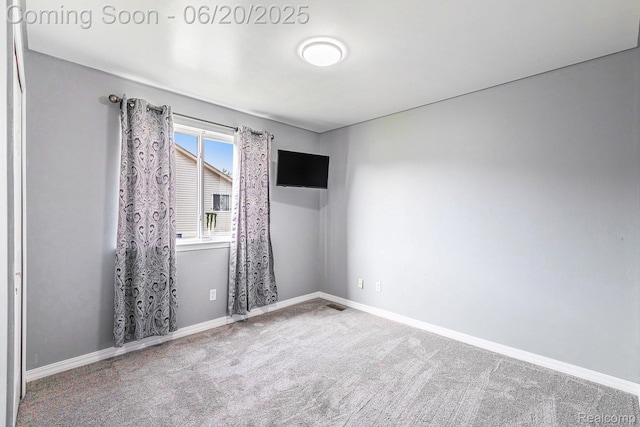 2274 Apple Tree Dr, Burton, MI 48519 - carpeted spare room featuring baseboards