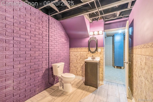 2274 Apple Tree Dr, Burton, MI 48519 - bathroom with vanity, a wainscoted wall, and wood finished floors