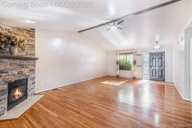 2274 Apple Tree Dr, Burton, MI 48519 - unfurnished living room with wood finished floors, a stone fireplace, and ceiling fan