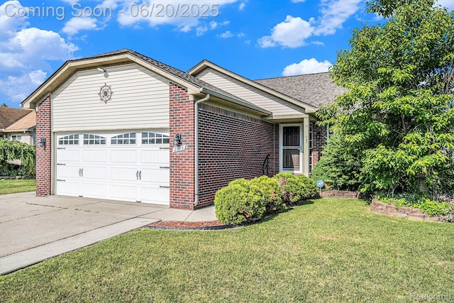 2274 Apple Tree Dr, Burton, MI 48519 - view of side of property featuring brick siding, a garage, concrete driveway, and a yard