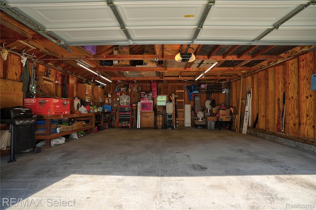 2249 Pauline Dr, Waterford, MI 48329 - garage with a workshop area and a garage door opener