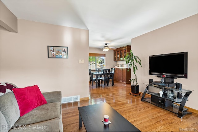 2249 Pauline Dr, Waterford, MI 48329 - living room with light wood-style floors and a ceiling fan